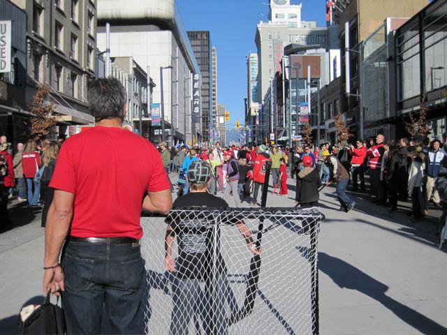 Granville Street in downtown Vancouver, where street hockey and red jerseys break out on a weekend afternoon / photo Danielle Egan 