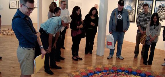 Canadian Art Gallery Hop Toronto participants take a closer look at the 2011 exhibition “Spin Off: Contemporary Art Circling the Mandala,” at the Koffler Gallery Off-Site. Drawing on a circle of support can also be helpful when funding artist projects. Photo: Jacob Ireland.