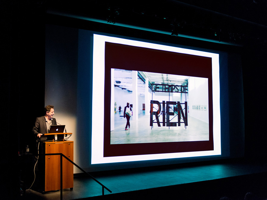 Jean de Loisy lecturing at Harbourfront Centre on November 8, 2012, and showing a research slide related to the Palais de Tokyo's current exhibition “Les Dérives de L'Imaginaire”/ photo Emma McIntyre 