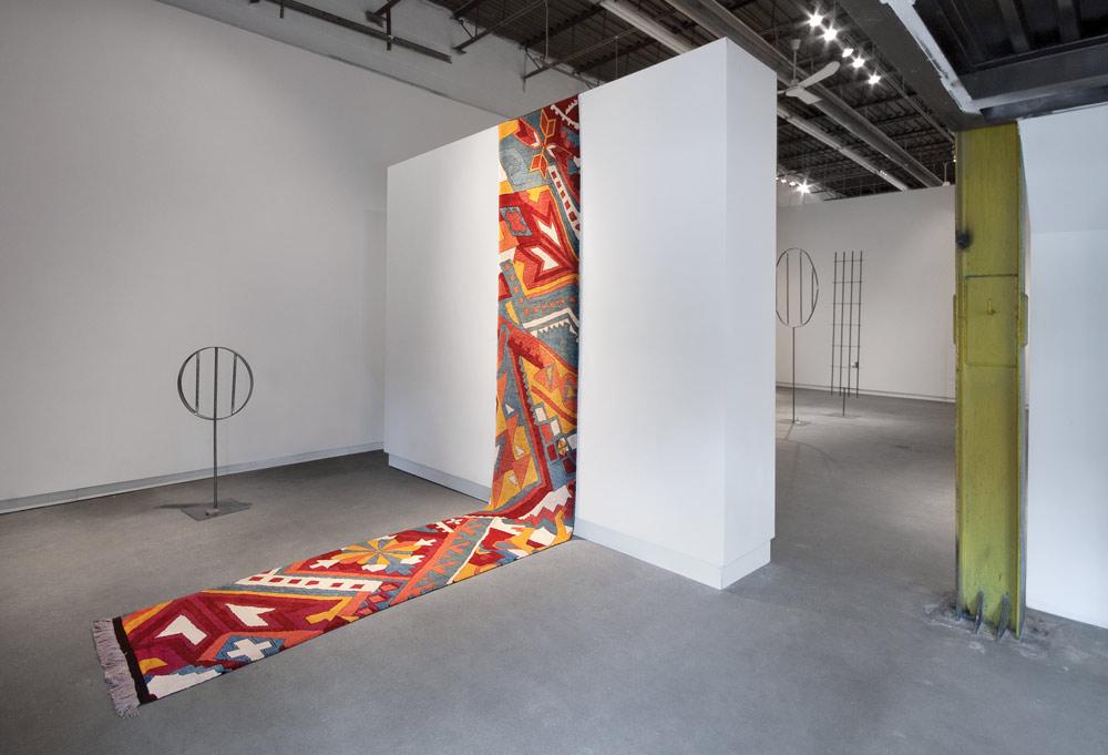 Installation view of Shannon Bool's “Patterns of Emancipation” with  <em>Casino Runner (Aztec Inn)</em> (2011) Courtesy Daniel Faria Gallery