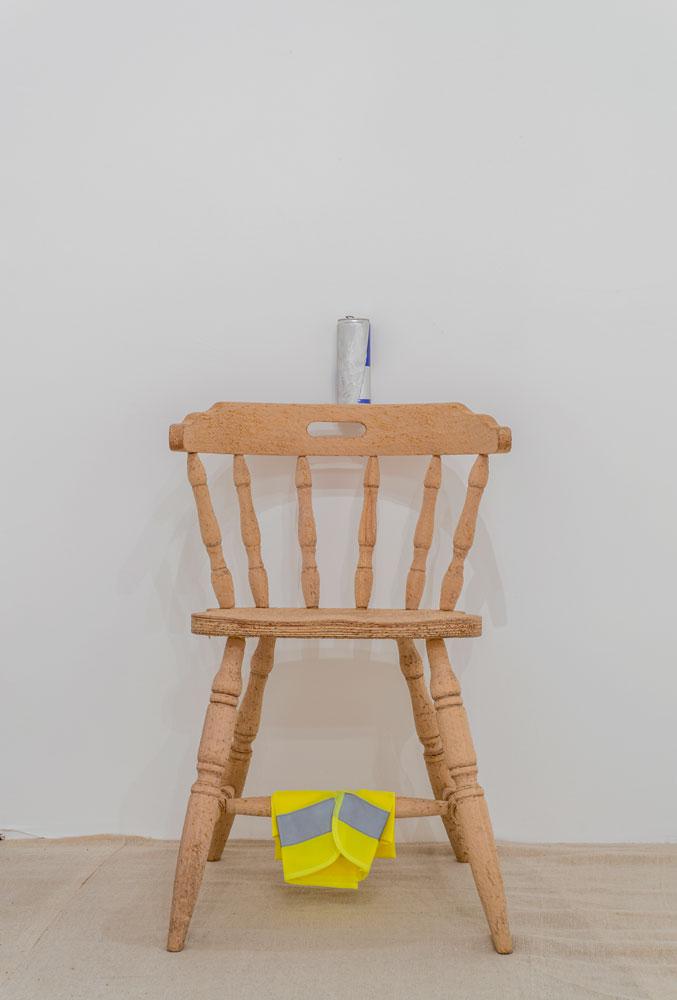 Scott Rogers, <em>Like Water in Water</em>, 2013. Hand-carved chairs, metal water bottles, various distressed objects. Installation view at Glasgow Sculpture Studios.