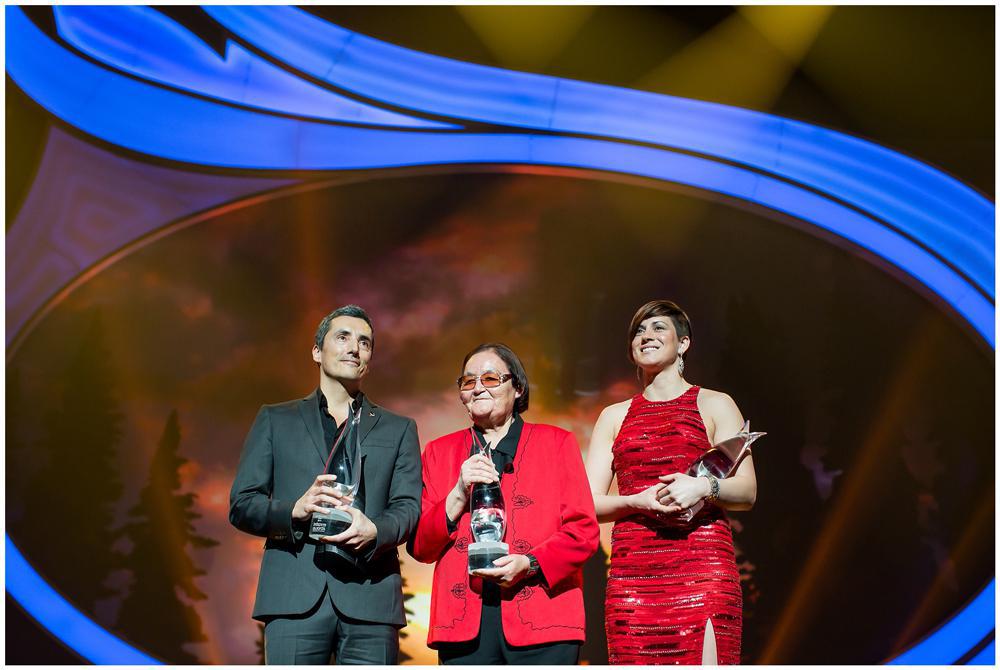 Kent Monkman (left) receives his Indspire Arts Award alongside Marion Meadmore (Indspire Law &amp; Justice winner, centre) and Mary Spencer (Indspire Sports winner, right).