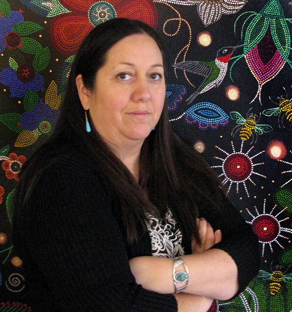 Visual artist and author Christi Belcourt with one of her works. Belcourt is the winner of this year's OAC Aboriginal Arts Award.