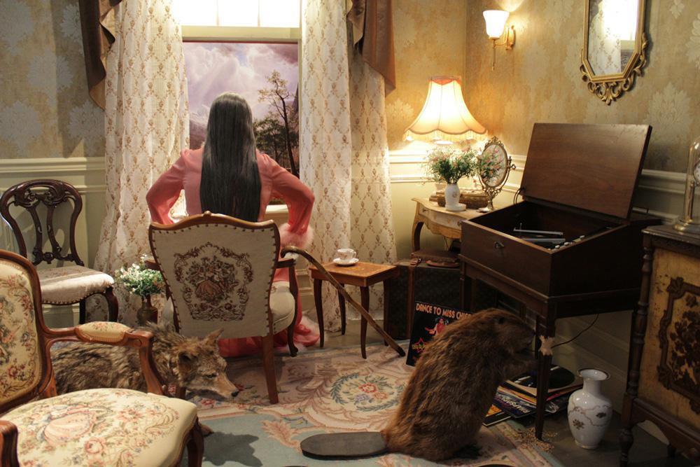 Kent Monkman, <em>The Collapsing of Time and Space in an Ever Expanding Universe</em>, 2011. Life-sized mannequin, antique furniture, paint, wallpaper, wood, taxidermied animals, audio, 21 x 14 x 16 feet. Collection Antoine de Galbert– Paris, France. Courtesy of the artist.