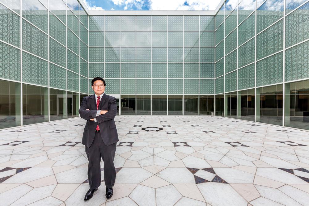 Aga Khan Museum director and CEO Henry S. Kim in the museum’s central courtyard, July 2014. Photo: Christopher Dew.