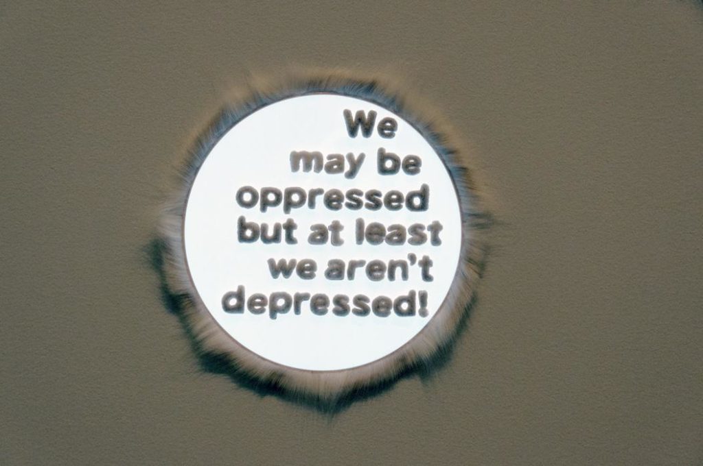 Amy Malbeuf, <em>D. Cardinal (We may be oppressed, but at least we aren’t depressed!)</em>, 2013. Sculpted natural caribou hair on light panel. 30.5 x 1.3 cm. Courtesy the artist.
