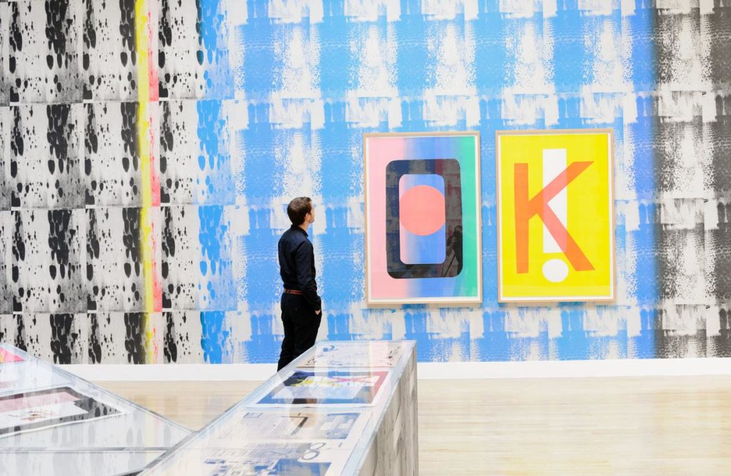 A Tate Britain visitor takes in Ciara Phillips's <em>Things Shared</em> (2014), the Canadian printmaker's Turner Prize installation. Copyright the artist. Courtesy Tate Photography.
