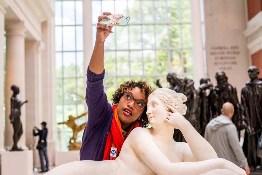A participant in a Museum Hack tour takes a selfie in the American Wing of the Metropolitan Museum of Art in New York. Photo: <a href="http://museumhack.com" target="_blank">Museum Hack</a> and Winston Struye.