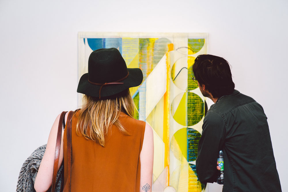 Gallery-goers look at artworks by Dil Hildebrand at Pierre-François Ouellette art contemporain during <em>Canadian Art</em> Gallery Hop Montreal in April 2015. Photo: Jean-Michael Seminaro.