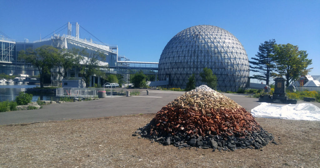 Opened with utopian ideals in 1971, and largely closed to the public in 2012 amid civic uncertainty, Ontario Place is hosting an art festival this month. Here, works by Ben Watt Myers (foreground, created from landfill cast-offs at Leslie Spit) and Acapulco (background) speak to the site as detritus and monument. Photo: Bryne McLaughlin. 