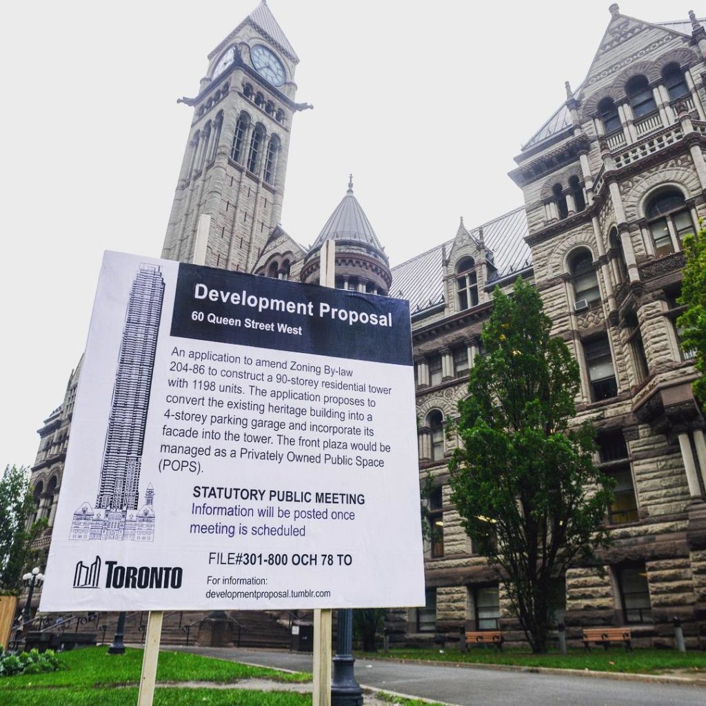 A parody sign outside of Toronto's Old City Hall notifies passerby that the heritage building will be turned into a parkade for a fictional condo tower. Photo: Daniel Rotsztain (<a href="https://www.instagram.com/p/BL1zs7Sl-ir/">@theurbangeog</a>) via Instagram.