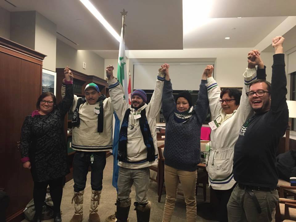 Inuk artist Billy Gauthier, third from left, celebrates with fellow hunger strikers, writer Delilah Saunders (fourth from left) and Jerry Kohlmeister (second from left), as well as other supporters, as government promises to review risks at Muskrat Falls hydro development in Labrador. Photo: Ossie Michelin via Twitter.