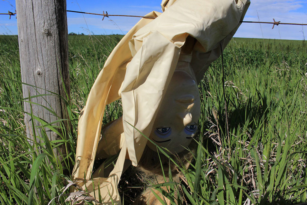 When she had just begun her long walk of Calgary's city limits, artist Alana Bartol found this sex doll wrapped up in a barbed wire fence. Its symbolism haunted the rest of her journey. Photo: Alana Bartol.  Courtesy the artist.