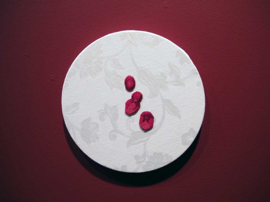 One of Vanessa Dion Fletcher's <em>Beading Works</em> (2016). Seven such hoops are presented in the exhibition. Photo: Kristina McMullin. 