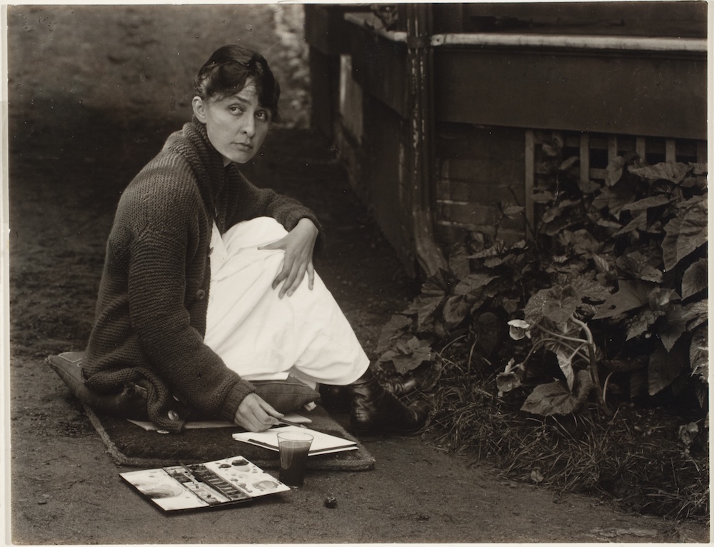 Alfred Stieglitz, <em>Georgia O'Keeffe with watercolor paint box</em>, 1918. Gelatin silver print on paper. George Eastman Museum, purchase and gift of Georgia O'Keeffe, 1974.0052.0045. Courtesy George Eastman Museum.