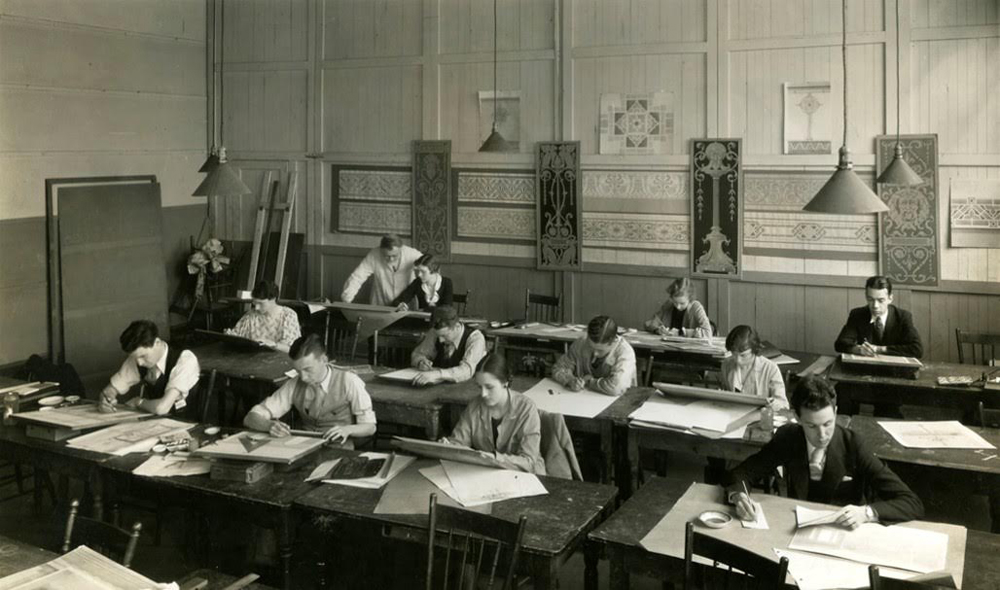 Students at work at George Reid House, the original 1921 campus building of the Ontario College of Art (OCA), with instructor Gustav Hahn in 1933–34. 
