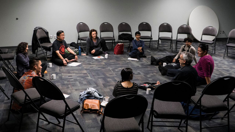 Participants in a Primary Colours gathering breakout session, facilitated by Walter Quan in response to the question “Where do artistic practices come from?” Photo courtesy of Primary Colours/Couleurs primaires (PC/Cp). 