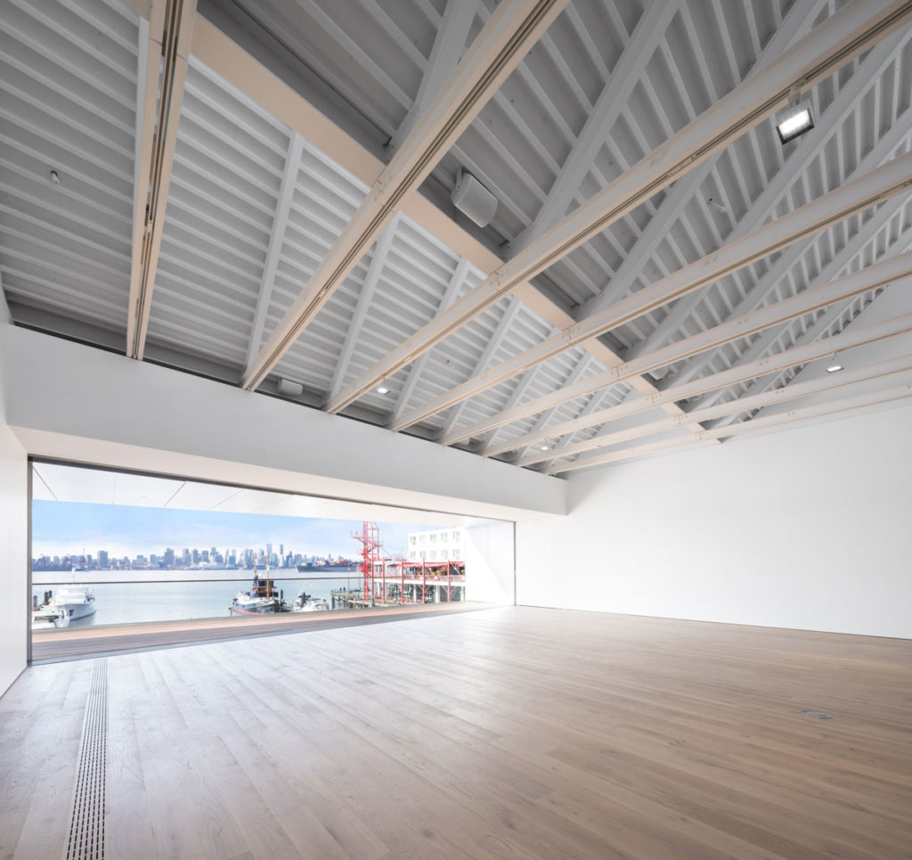A view of one of the Polygon Gallery spaces prior to installation of artwork. The gallery is proximal to Lonsdale Quay, with several glass walls generating connections between artworks indoors and the landscape outdoors. Photo: Courtesy Polygon Gallery.