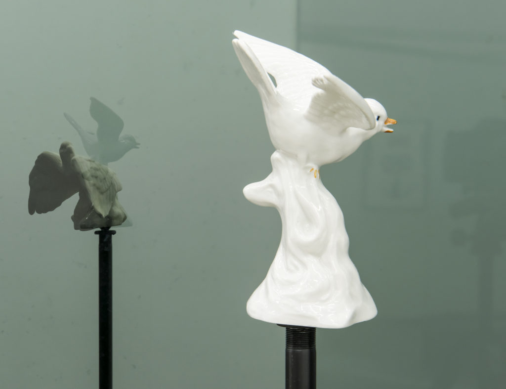 Judy Radul, <em>Connector Divider (Hawks, Sparrows, Pigeons, Doves, Ducks, Eagles)</em> (detail), 2018. Salvaged glass, aluminum, found ceramic figurines and microphone stands, 2.07 x 2.44 x 5.87 m. Courtesy Catriona Jeffries. Photo: SITE Photography. 