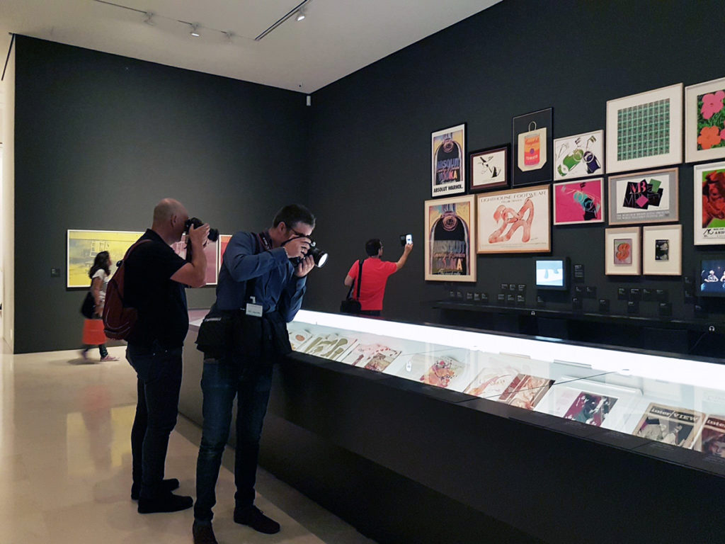 The official opening of “Warhol. Mechanical Art” at the Museo Picasso Málaga, featuring multiple album covers, posters and magazines from the collection of Paul Maréchal. Photo: Facebook.