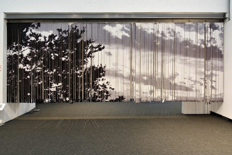 Kelly Jazvac, <em>Browsing</em>, 2016. Salvaged billboard and thread, 2.4 x 6.49 m. Collection of the artist. Courtesy Museum London. Photo: Lucas Stenning. 