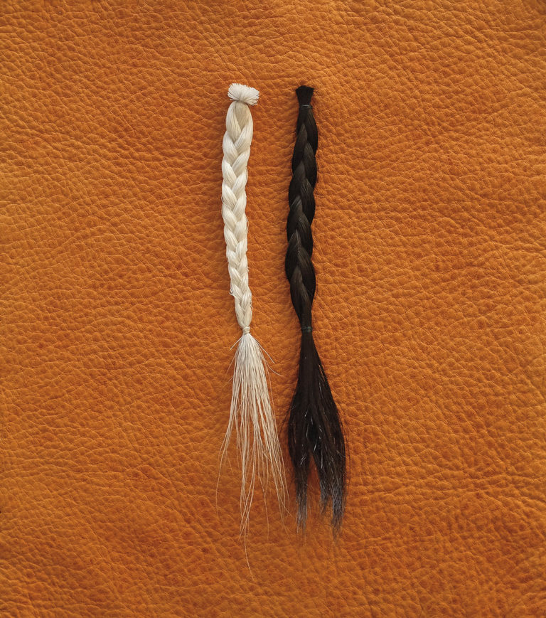 Amy Malbeuf, <em>iamthecaribou/thecaribouisme</em>, 2014. Caribou hair and the artist’s hair on elk hide, 20.3 x 22.8 cm. Courtesy of the artist.