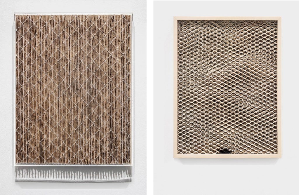 Left: Tegan Moore, <em>Dust in the Heat</em>, 2018. Used ventilation filter, clay dust, wood dust, other particulate matter and acrylic glass, 43.1 x33 cm. Right: Tegan Moore, <em>We / liked / the feeling / of it</em>, 2018. Humidifier filter (expanded aluminum, clay), soft maple and conservation glass, 33 x 25.4 cm. Courtesy the artist / Zalucky Contemporary. 