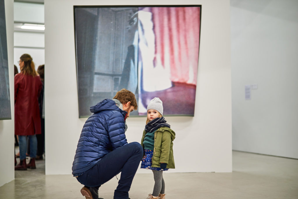 Visitors to Leisure’s exhibition “How One Becomes What One Is” at Musée d’art de Joliette in front of <em>Dualité/Dualité</em> (2015). Photo: Romain Guilbeault.