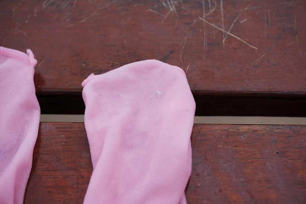 A set of pink tights used in “BabyLegs” trawl with what is (probably) a white microplastic, 2016. Photo: Maya Weeks.
