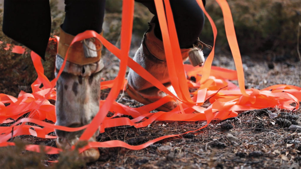Meagan Musseau, <em>when they poison the bogs we will still braid sweetgrass</em>, 2017. Digital video still from a land-based performance on Treaty 7 Territory, 10 minutes, 42 seconds. Courtesy the artist.