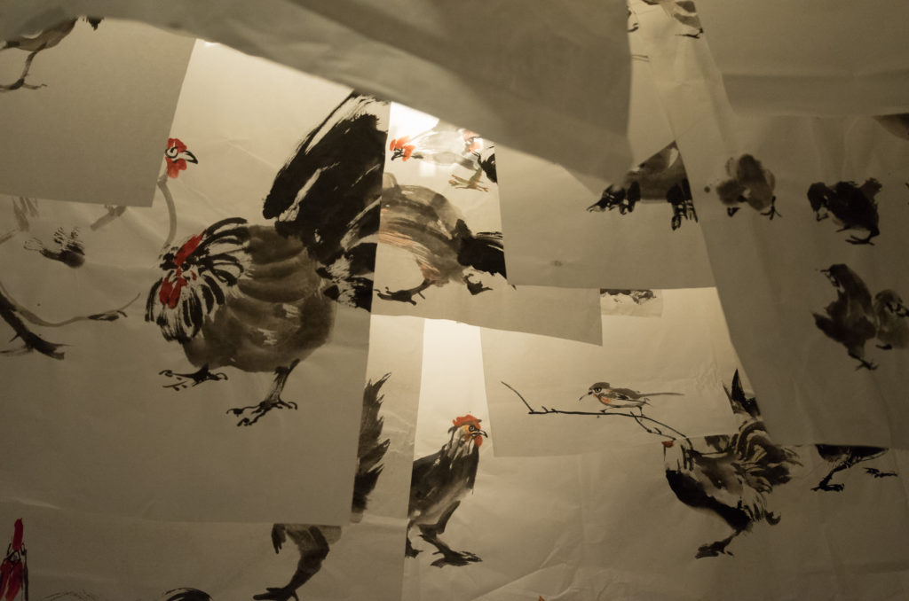 Karen Tam, <em>With wings like clouds hung from the sky 大鵬就振翼</em>, 2017. Installation with found, bought and fabricated objects and artwork, as well as historical artworks in the Art Gallery of Greater Victoria collection, and paintings by local Chinese ink-and-brush painters, 14.5 x 9.32 x 3 m. Courtesy the artist. 
