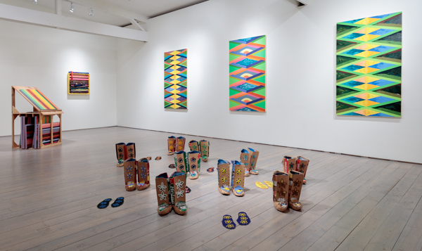 Charlene Vickers, <em>The Singles: Performance Moccs</em>, 2018. Whiskey case cardboard, beer case cardboard, cotton fabric, glass beads and cedar blocks, dimensions variable.