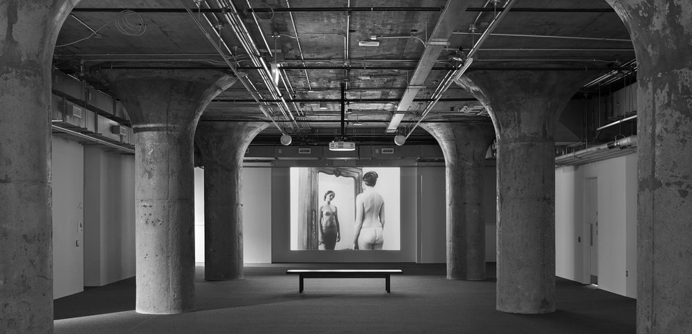 Chantal Akerman, <em>In the Mirror</em>, 2007. 16mm black-and-white film transferred to digital format, 14 min 21 sec. Installation view at MOCA Toronto. Photo: Tom Arban Photography Inc. 