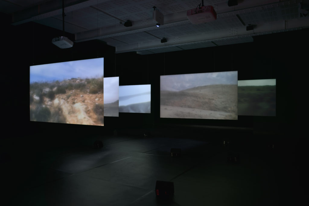 Chantal Akerman, <em>NOW</em>, 2015. Multiple-channel HD video installation, 5 back projections on Plexiglas
screens, 2 floor projections, colour, 5 mono and stereo soundtracks,
various objects, looped, duration variable. Installation view at MOCA Toronto. Courtesy Chantal Akerman Foundation/Marian Goodman Gallery, New York, Paris, London. Photo: Rebecca Fanuele.