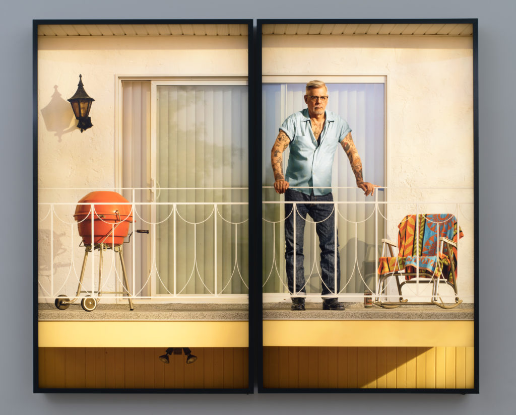 Rodney Graham, <em>Tattooed Man on Balcony</em>, 2018.
Two painted aluminum lightboxes with transmounted chromogenic
transparencies, 278 x 333 x 18 cm overall. Edition of 3.