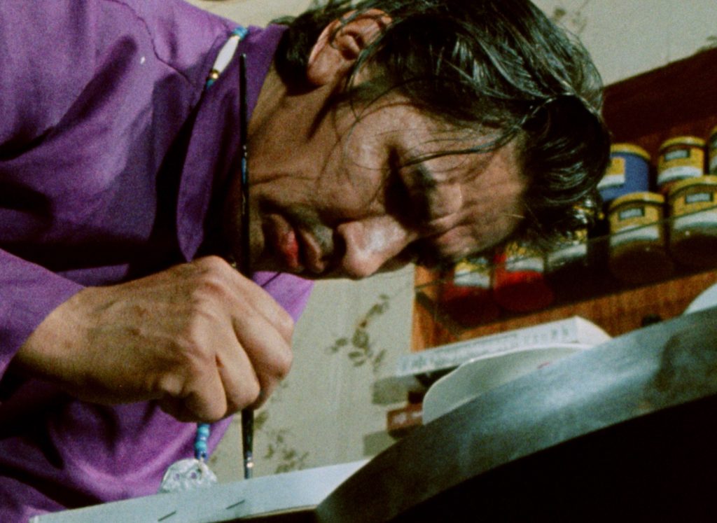 Norval Morrisseau working on a painting in the 1970s. Photo: Courtesy NFB.