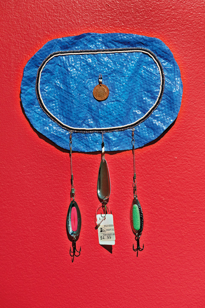 Taqralik Partridge, <em>Tusarsauvungaa</em> (detail), 2018. Series of five elements with cotton, polyester, wool, silk, glass beads, metal beads, Canadian sealskin, reindeer leather, thermal emergency blanket, Pixee lures, plastic tarp, Canadian coins, tamarack tree cones, dental floss, artificial sinew, goose feather and river grass. Dimensions variable Photo: Paul Litherland / Studio Lux. Courtesy Leonard and Bina Ellen Art Gallery.