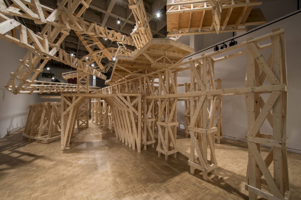 Steve Higgins, <em>Beyond the Terminating Vista (Rebuild)</em>, 2013. Building lumber, 60 x 20 x 20 ft. Mount Saint Vincent University Art Gallery.