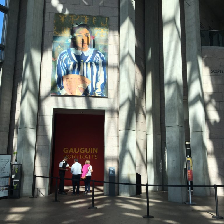 Above the entrance to “Gauguin: Portraits” is a large banner featuring an Indigenous figure from <em>Merahi metua no Tehamana</em> (1893). Gauguin’s images of Indigenous women predominate in the National Gallery of Canada’s advertising of the exhibition. Photo: Leah Sandals.