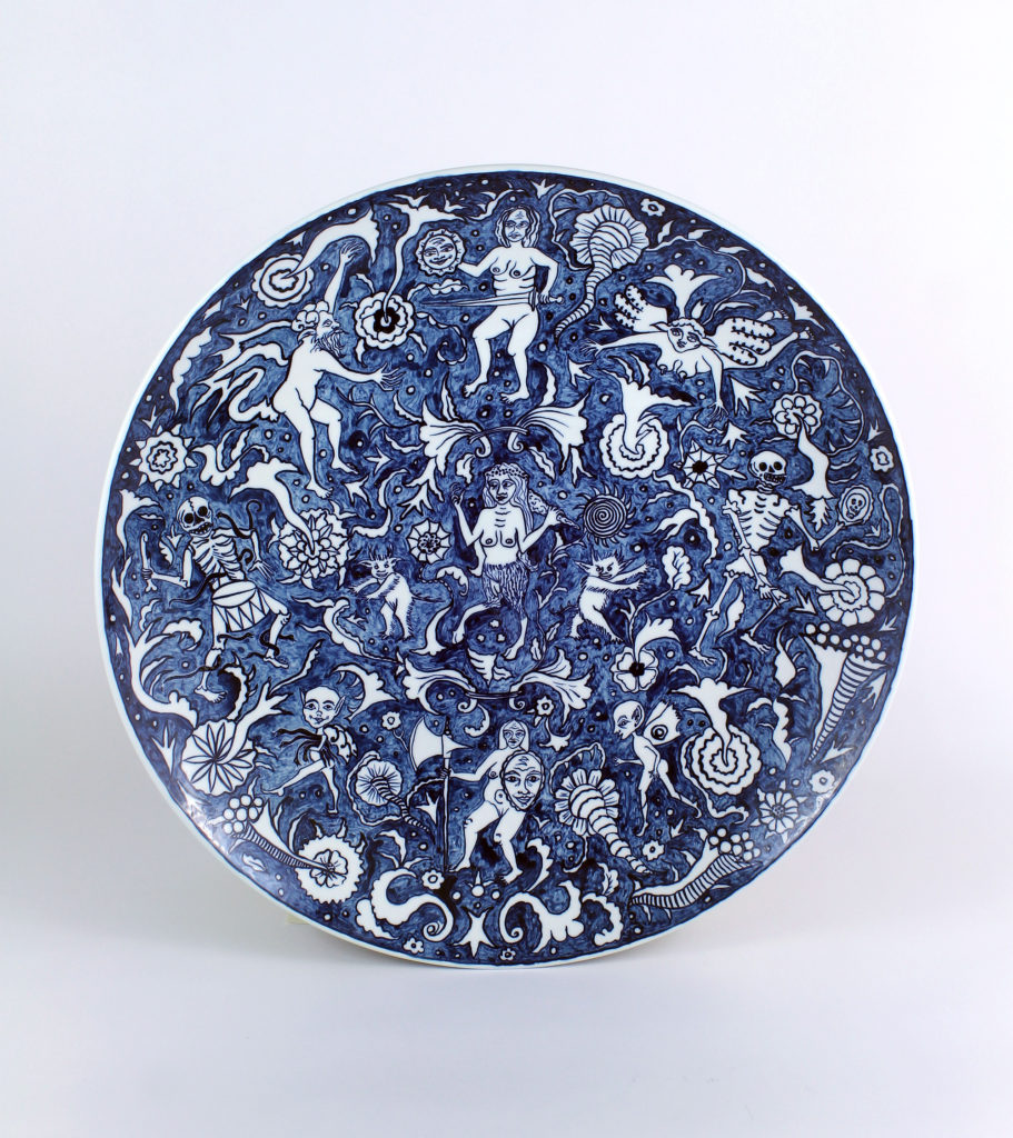 Lindsay Montgomery, <em>Monster Faience 1 - The Resistance</em>, 2018. Press-molded Jingdezhen porcelain, painted with cobalt paste, sprayed clear glaze. 46 cm diameter. Photo: Lindsay Montgomery.