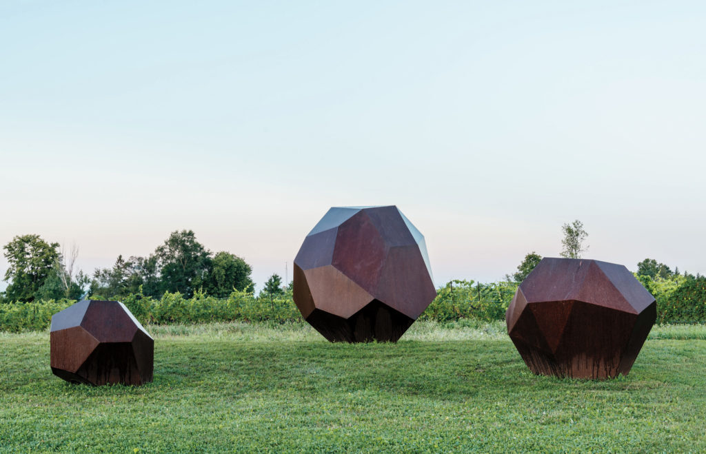 Shayne Dark’s <em>Glacial Series: Drop Stones 1, 2, and 3</em> (2015) in the sculpture garden at Oeno Gallery in Prince Edward County. Photo: Johnny Lam.