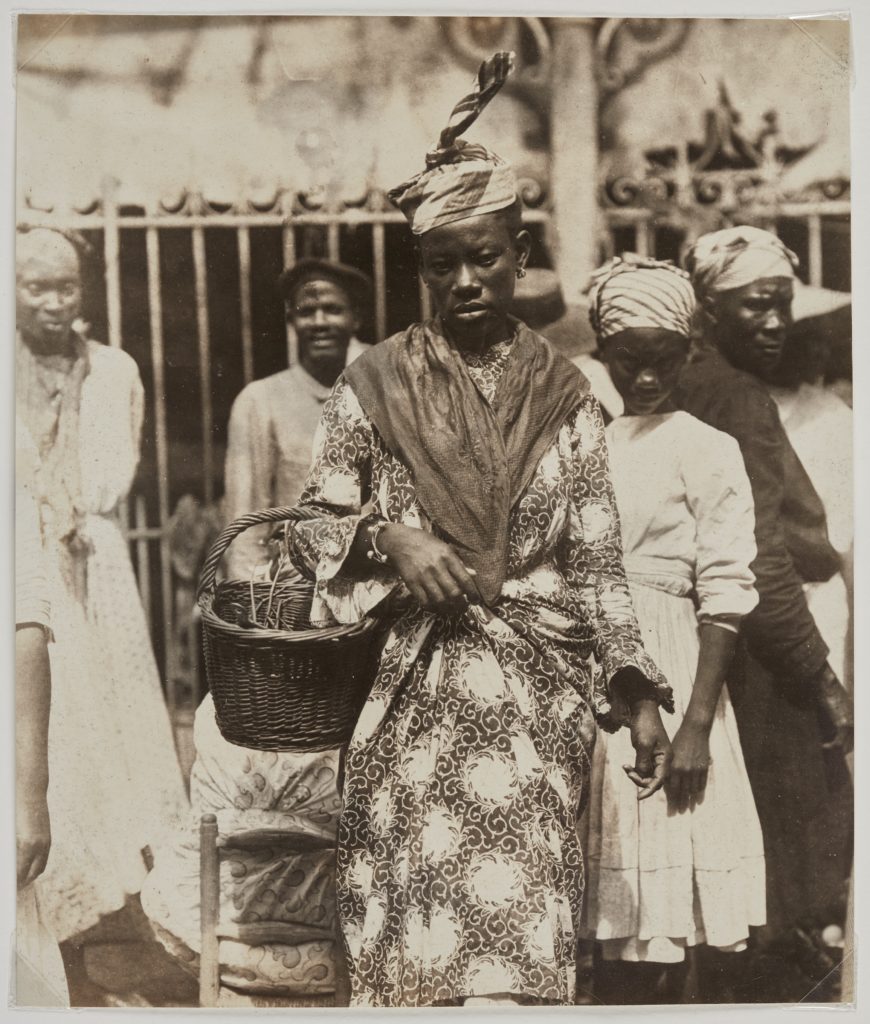 Unknown photographer, <em>At The Market, Martinique</em>, c. 1895. Albumen print, 22.2 x 18.4 cm. Montogomery Collection of Caribbean Photographs. Donor funds to acquire the Montgomery Collection of Caribbean Photographs include the support of Dr. Liza and Dr. Frederick Murrell, Bruce Croxon and Debra Thier, Wes Hall and Kingsdale Advisors, Cindy and Shon Barnett, Donette Chin-Loy Chang, Kamala-Jean Gopie, Phil Lind and Ellen Roland, Martin Doc McKinney, Francilla Charles, Ray and Georgina Williams, Thaine and Bianca Carter, Charmaine Crooks, Nathaniel Crooks, Andrew Garrett and Dr. Belinda Longe, Neil L. Le Grand, Michael Lewis, Dr. Kenneth Montague and Sarah Aranha, Lenny and Julia Mortimore, and The Ferrotype Collective, 2019.