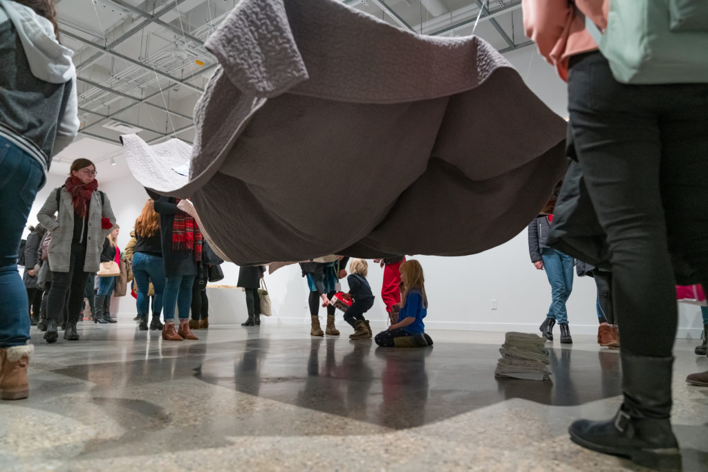 A view of Tiffany Shaw-Collinge’s installation <em>Passage</em> (2019) during a reception for “Mothering Spaces” at the Mitchell Art Gallery. 