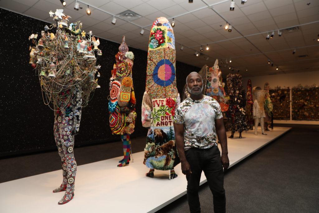 Nick Cave with his Soundsuits in the exhibition Feat. at Glenbow Museum in Calgary, 2019. Photo: Zoltan Varadi.