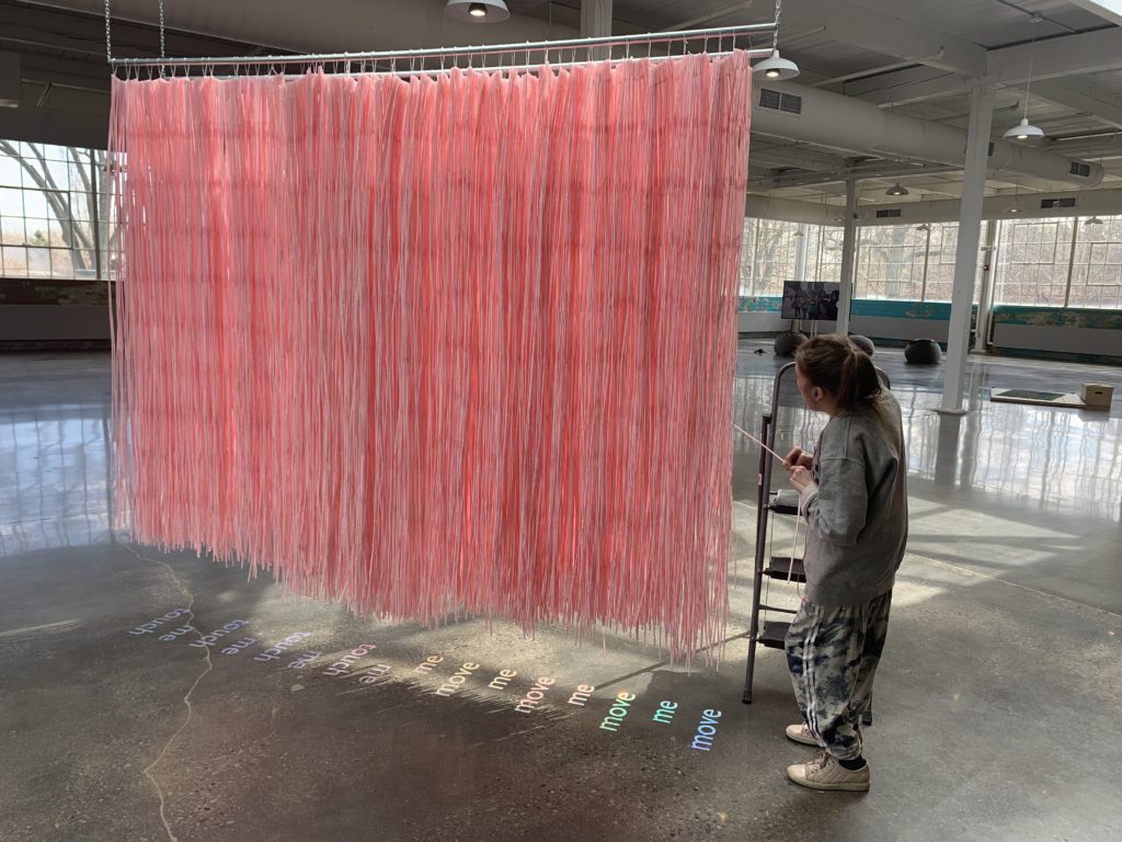 jes sachse, <em>Freedom Tube</em> (detail), 2019. Installation with straws, text and vinyl at the Small Arms Inspection Building. Courtesy the artist.