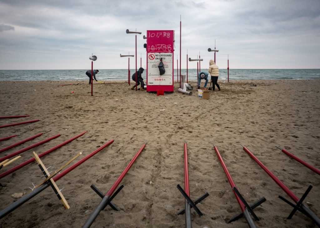 OCAD University students install <em>Revolution</em> as part of the 2018 Winter Stations public art exhibition at Woodbine Beach, Toronto. Studying curating and criticism at an art school provides many opportunities to interact with emerging practitioners in art and design. Photo: Facebook/OCAD University.