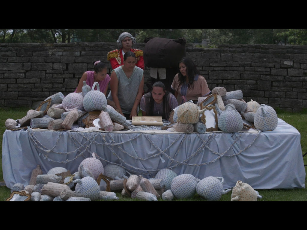 Video still from <em>By These Presents: “Purchasing” Toronto</em>, a Talking Treaties installation by Ange Loft, Martha Stiegman and Victoria Freeman, 2019. Edited by Amy Siegel and Adrienne Marcus Raja. Commissioned by the Toronto Biennial and produced by Jumblies Theatre. Courtesy Jumblies Theatre.