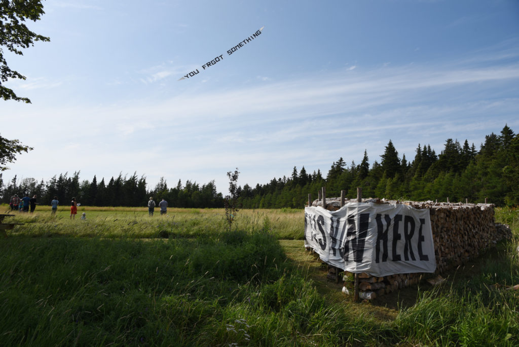 Among the installations in the Ark at Wood Point was a floating kite by Andrew Maize and Amanda Jernigan titled <em>You Forgot Something</em> (2019). A solo work by Maize was installed on the woodpile. Photo: John Haney.