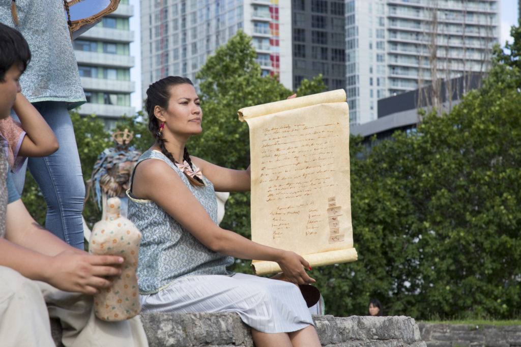 Performance still featuring Kitsune Soleil during <em>Talking Treaties Pageant</em>, produced by Jumblies Theatre, at Historic Fort York, Toronto, June 2017. Courtesy Jumblies Theatre. Photo: Liam Coo. 