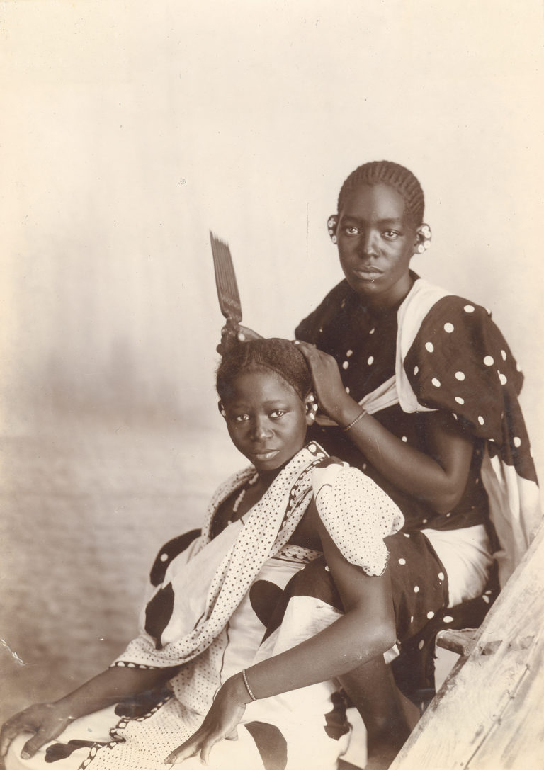A. C. Gomes & Sons, <em>Natives [sic] Hair Dressing, Zanzibar, Tanzania</em>, late 19th century. Collodion printed-out print. Courtesy of The Walther Collection and Stevenson, Cape Town and Johannesburg.